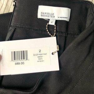 NWT. Danielle Bernstein by WeWoreWhat black scoop front flared pant. Size 2
